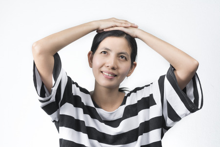 portraits Asian woman is doing think and Take the head pointing to the temples on white background.の写真素材