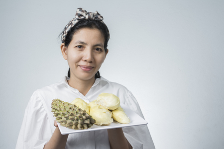 Portriats Aisan Women and dishes with durian paste is a popular fruit of the Thai people. with space for text.の写真素材