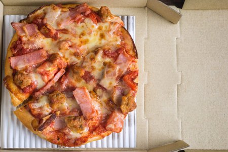 Open a Small Pizza Box filled with Ham and Bacon. with Space for text.の写真素材