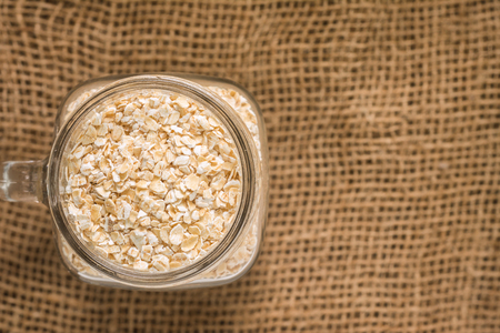 Top View of Oats Dry Seed In a well-preserved jar ready to serve breakfast for the family. with Space for Text.の写真素材