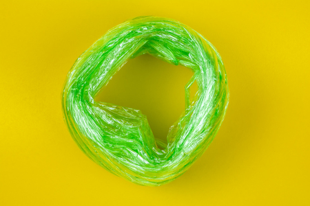 Top View of Green Plastic rope. on yellow Background.For tie items are popular. And is made of plastic.の写真素材