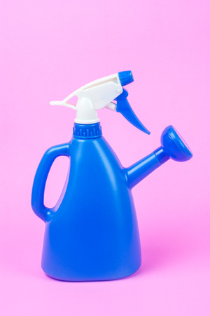 Watering can Made of plastic on a pink backdrop. For watering the trees and can be sprayed into the mist.の写真素材