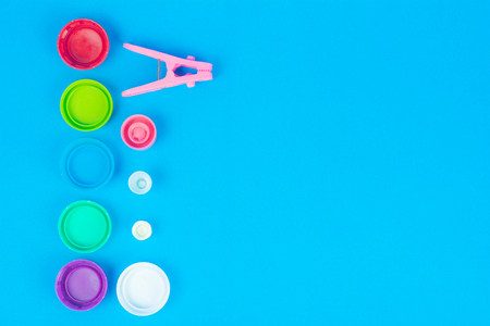 Products made of plastic are arranged on Blue background. We use it in everyday life. with space for text.の写真素材