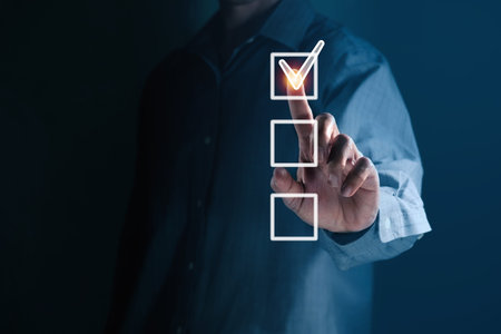 Business Man's hand ticking a check mark Correct with copy space for your text.の写真素材