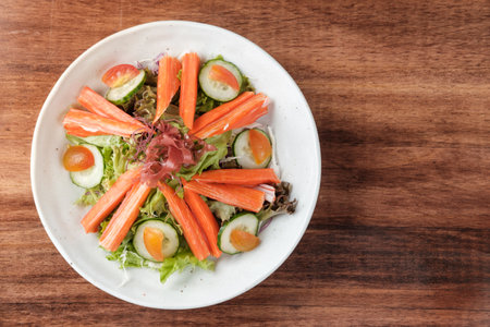 Top View of Mixed Greens Salad with Crab Sticks with copy space for your text.の写真素材