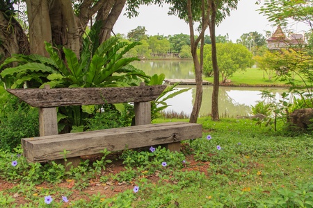 Wooden bench in gardenの写真素材