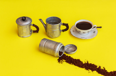 a maker of aluminium removed after filling the cup of coffee with the strip of coffee-powder that comes out from the filterの写真素材