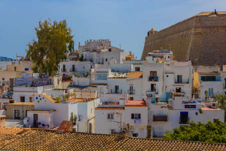 view of old Ibiza with typical white houses and restaurants near the bulwark of Saint Luciaのeditorial素材