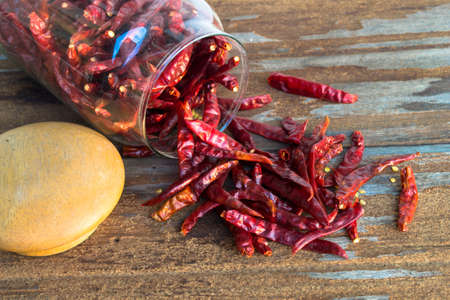 Dried red chilli on wooden backgroundの写真素材