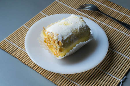 Roll cake with almondの写真素材