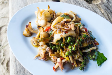 Thai fried spicy squid in basil sauceの写真素材