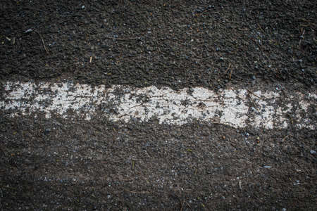 old white line on the road textureの写真素材
