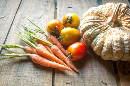 organic vegetables on wooden backgroundの写真素材