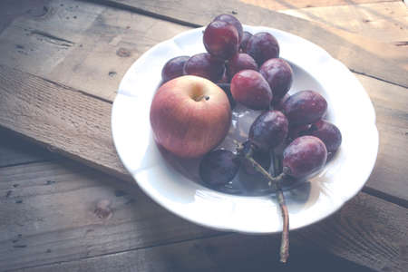 organic purple grapes and appleの写真素材