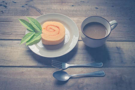 orange slice roll cake  and coffeeの写真素材
