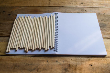 notebook recycling , pencil on wooden