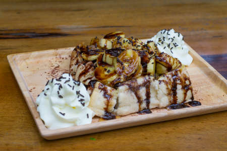 Toast topped with banana and chocolateの写真素材