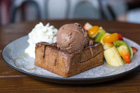 Ice cream and fruit salad almond toast breadの写真素材