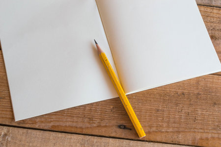 notebook recycling , pencil on wooden