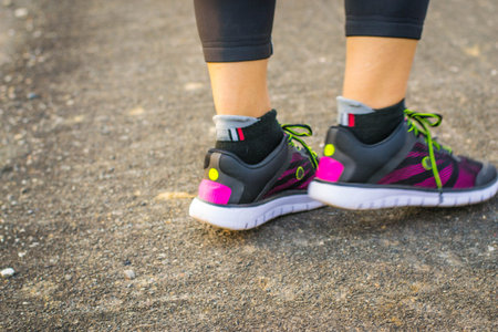 woman wearing sports shoes, walking or running