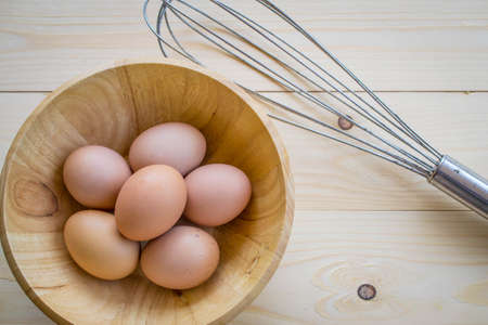 eggs and hand whiskの写真素材