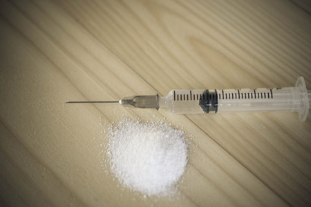 Drug and syringe