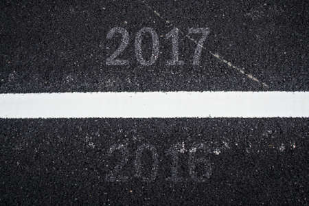 Good bye Old year 2016 and Happy New year 2017 on Asphalt Texture Backgroundの写真素材