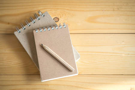 Recycled paper notebook and pencilの写真素材
