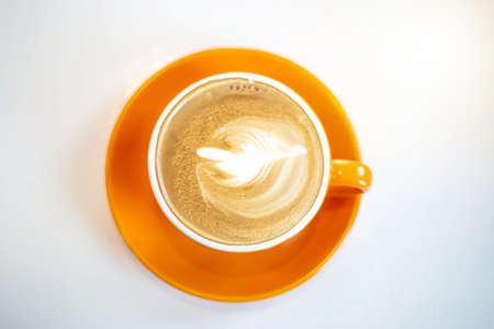 Latte hot coffee in a white cupの写真素材