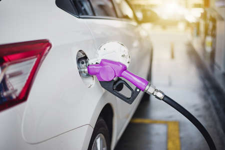 Refuelling the car at a gas stationの写真素材
