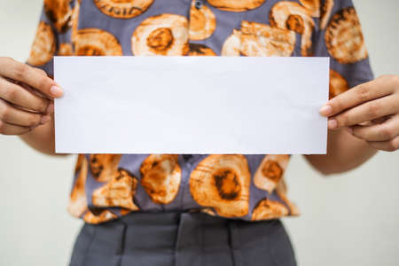 Young Woman Holding Blank paperの写真素材