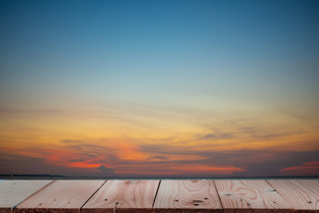 Wood plank table top on Sea during sunset