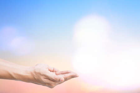 Human Hands and Blurred Bueatiful sunset sky, Beach, clouds.の写真素材