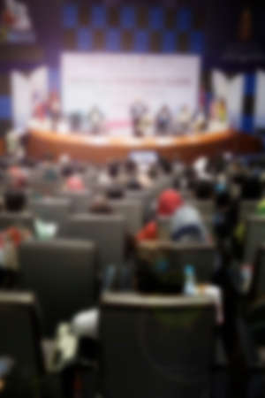 blurred image of many row of chairs set for conference, education, dinner or meeting event with large hall.の写真素材