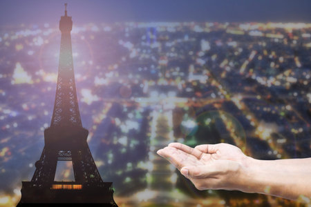 Empty female open human hands prayer with abstract Background top view of Paris in lights and bokeh. Concept for pray for Paris, Thanksgiving, Christmas, Forgiveness.の写真素材