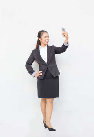 Business woman holding cellphone.  の写真素材