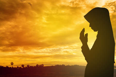 Muslim Woman pray and Beautiful background. pray for ramadan, pray for Syrian Civil Warの写真素材