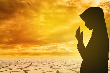 Muslim Woman pray and Beautiful background. pray for ramadan, pray for Syrian Civil Warの写真素材