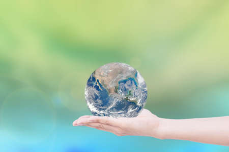 Hand giving the Earth. save the earth.の写真素材
