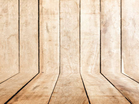 Wooden board table  in front of wood backgroundの写真素材