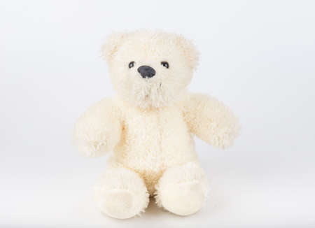 Teddy Bear on Isolate background. bow cute art nice love floor baby play child one joy doll studio toy object animal concept romantic retro worry young give apologize forgiveness plush single babe old whiteの写真素材