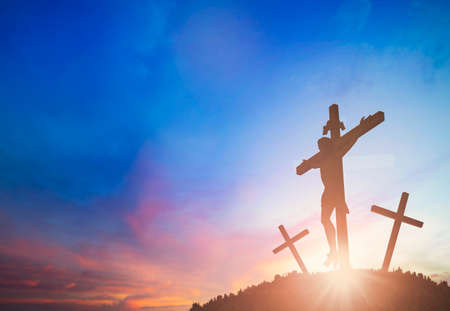 Silhouette of Jesus with three Cross over sunset concept for religion, worship, Christmas, Easter, Redeemer Thanksgiving prayer and praiseの写真素材