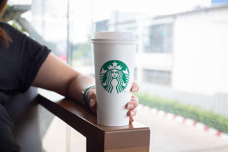 Hatyai ,Thailand-August 05 : Young beautiful woman pregnant with Starbucks Hot beverage coffee on hand on 05 August 2017 at Central Festival, Hatyai, Thailand.のeditorial素材
