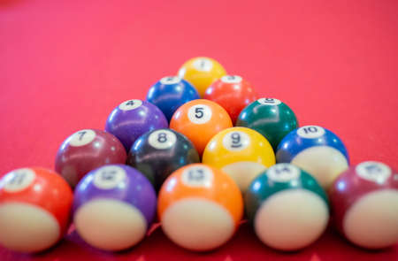 Billiard ball on red table background in pub bar room concept for sport gamble activity, game play competition.の写真素材