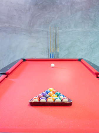 Billiard ball on red table background in pub bar room concept for sport gamble activity, game play competition.の写真素材