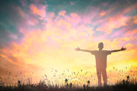 Happy man rise hand on morning view. Christian inspire praise God on good friday background. Now one man self confidence on peak open arms enjoying nature the sun concept world wisdom fun hopeの写真素材