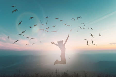 Happy man rise hand on morning view. Christian inspire praise God on good friday background. Now one man self confidence on peak open arms enjoying nature the sun concept world wisdom fun hopeの写真素材