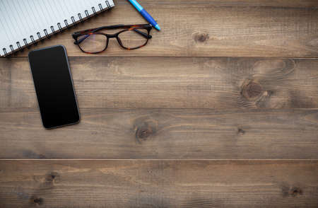 Vintage white paper smartphone mockup flat lay on old table top wood background texture space concept workspace office blank note, plan on calendar new year 2019, business blogger idea empty text viewの写真素材