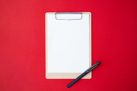 Vintage white space do paper list mockup flat lay on red table top background texture concept blank...