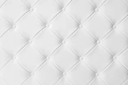 Light white luxury upholstery sofa texture background concept for clean gray vintage leather furniture pattern wallpaper, closeup interior elegant armchair mattress surface detail, real tuft material.の写真素材